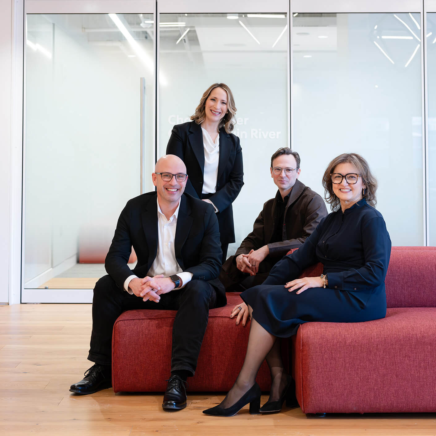 Perkins&Will's Chief Marketing Officer and Boston Studio Leadership - Yanel de Angel, Andrew Grote, Vickie Alani, and Patrick Cunningham, gathered together.