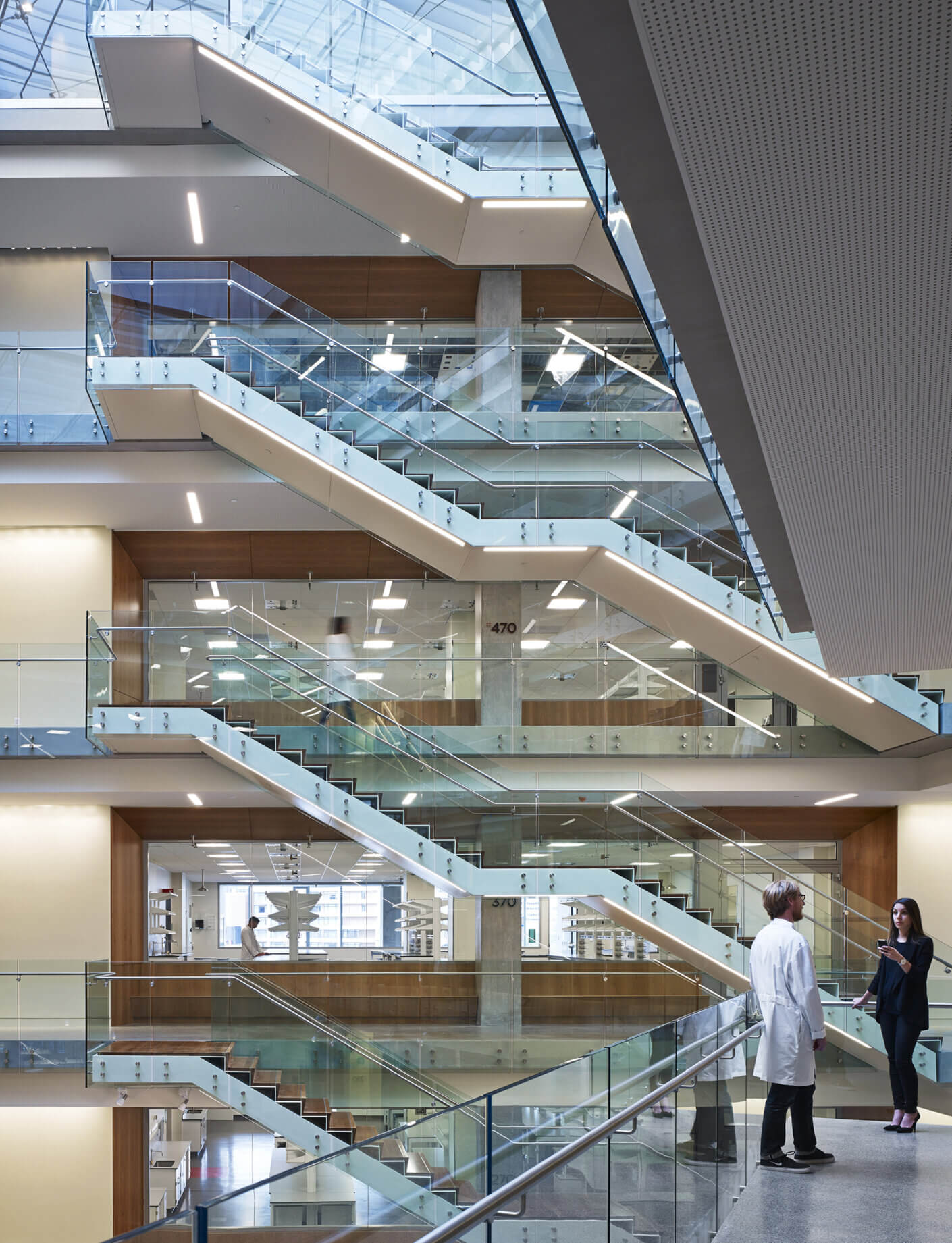 Large atrium with stairs and views to four stories of research labs