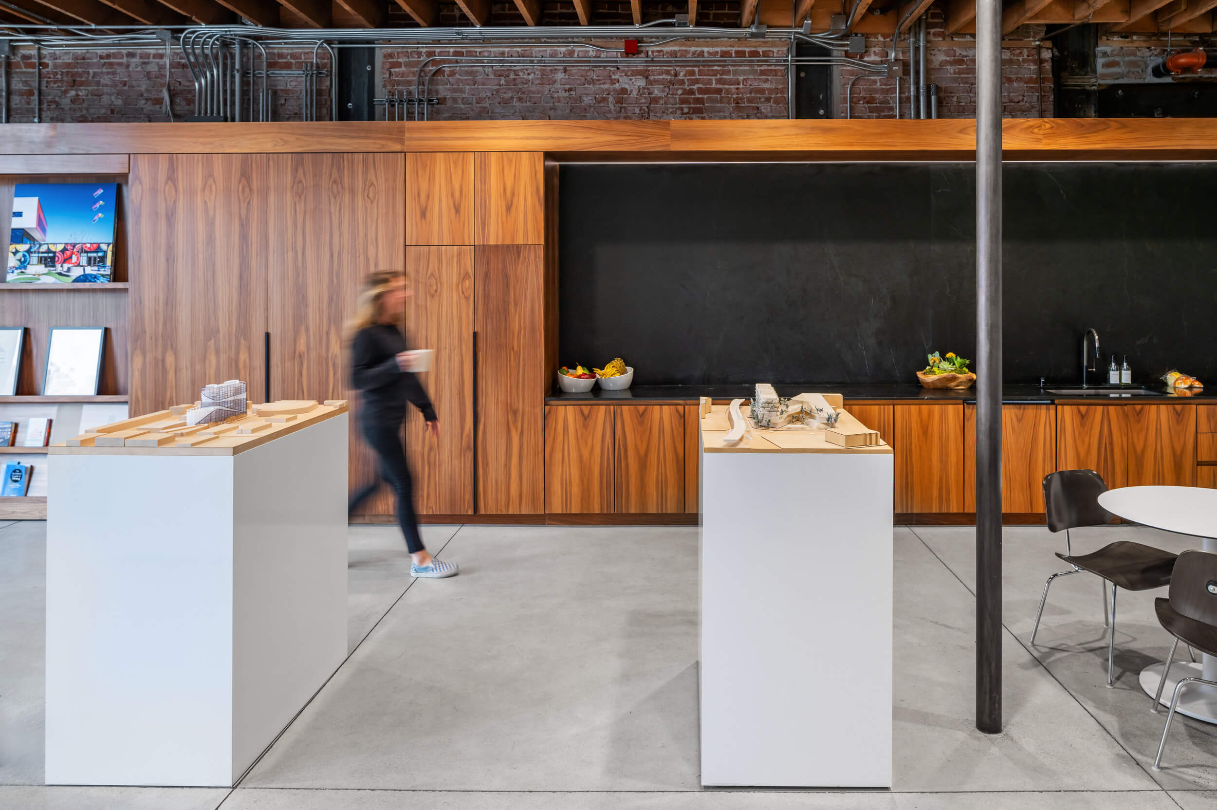 Modern office interior with wood cabinets and sleek design elements.
