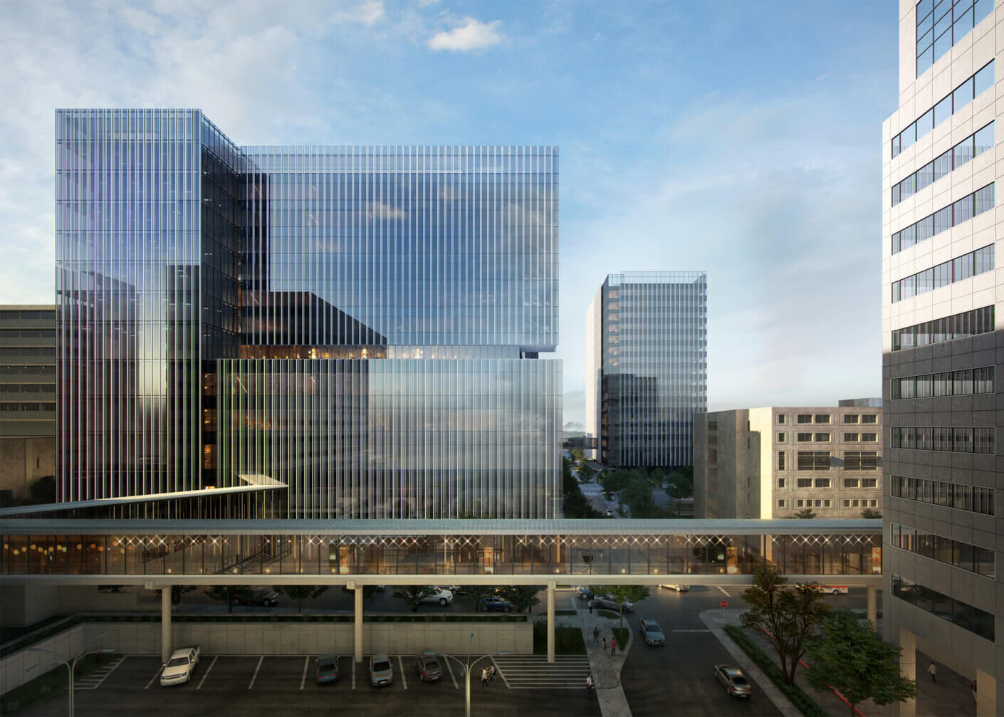 Modern glass skyscraper with skybridge in urban setting