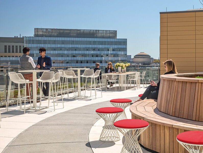 roof top patio with views to city and people socialzing