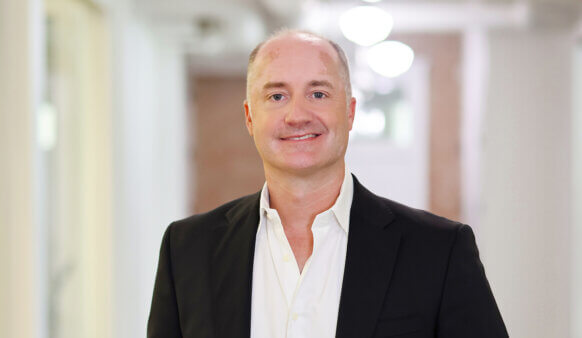 headshot of a smiling Kevin Mereness