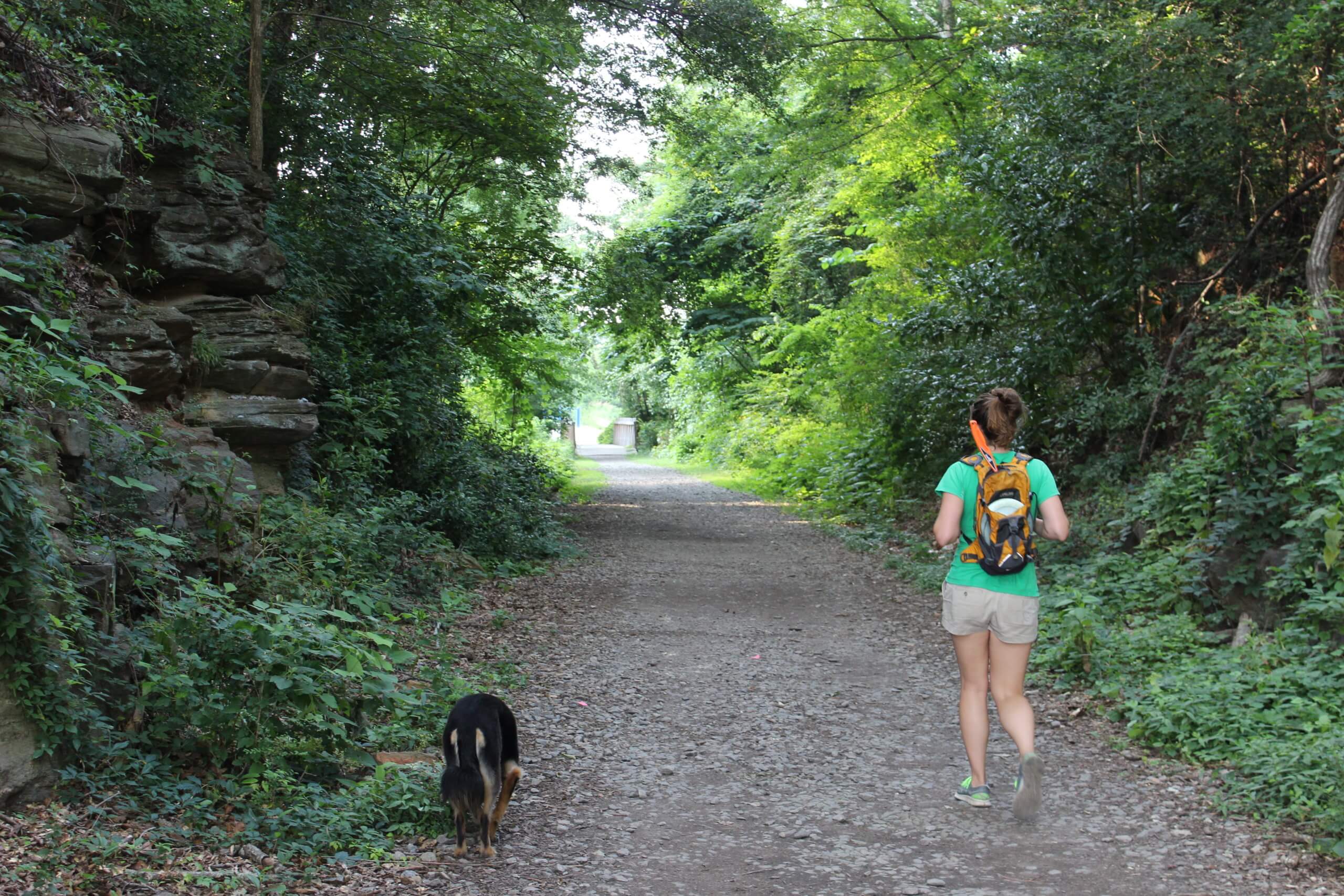 Nicole and her dog walk down a shaded portion of the Atlanta BeltLine's Eastside Trail in 2013