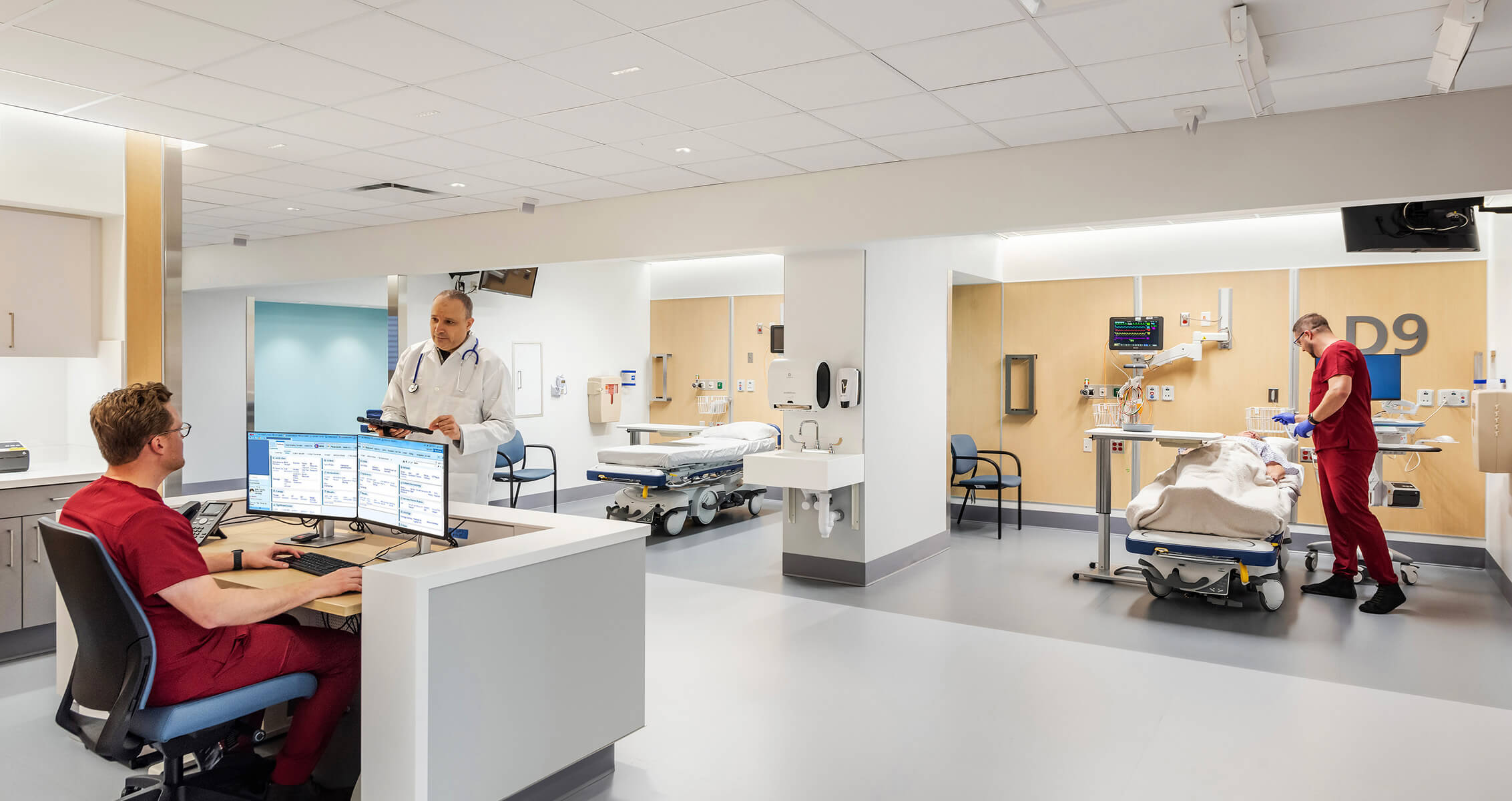 Healthcare professionals in a modern hospital prep and recovery area.