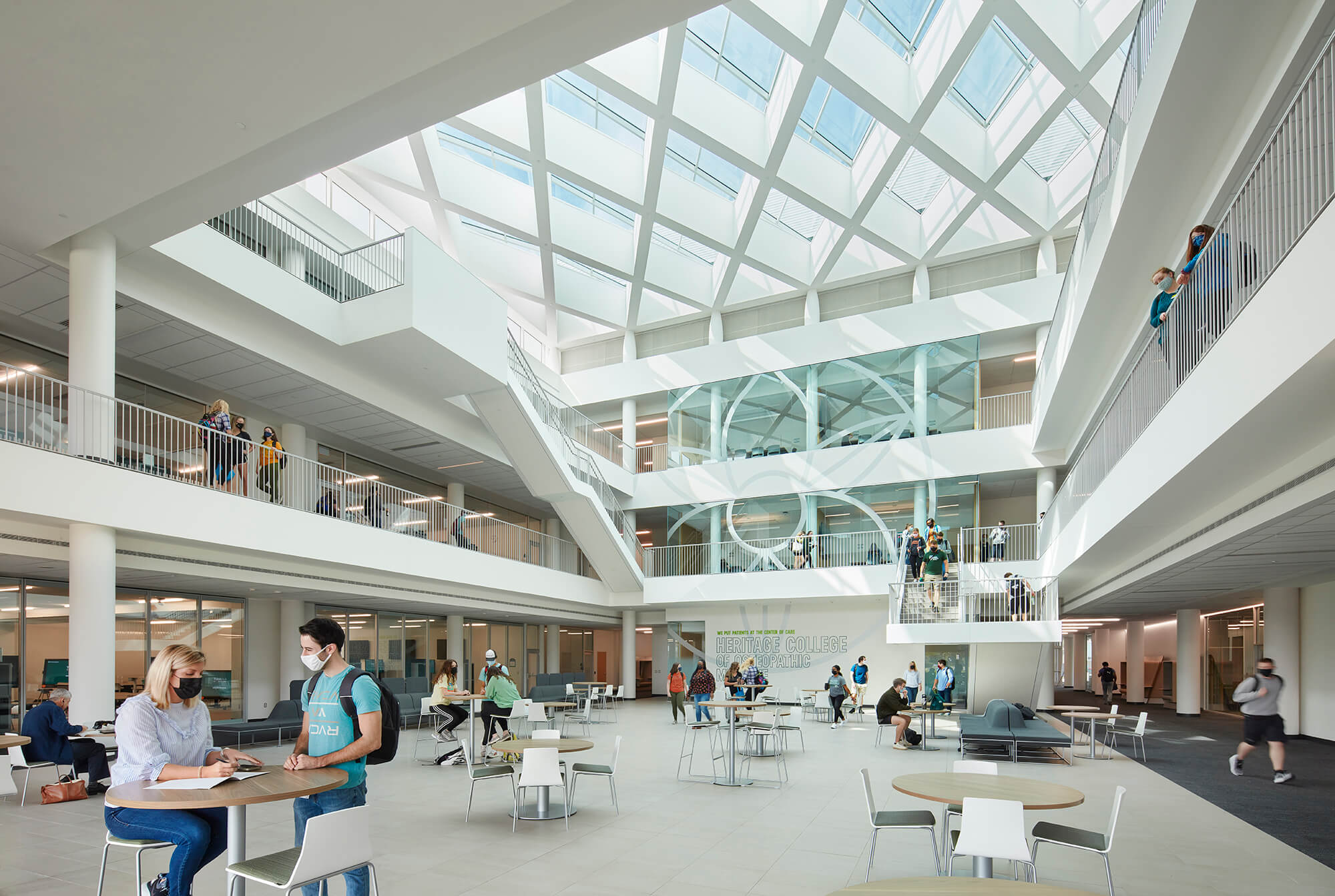Photo showing medical students in glass atrium.