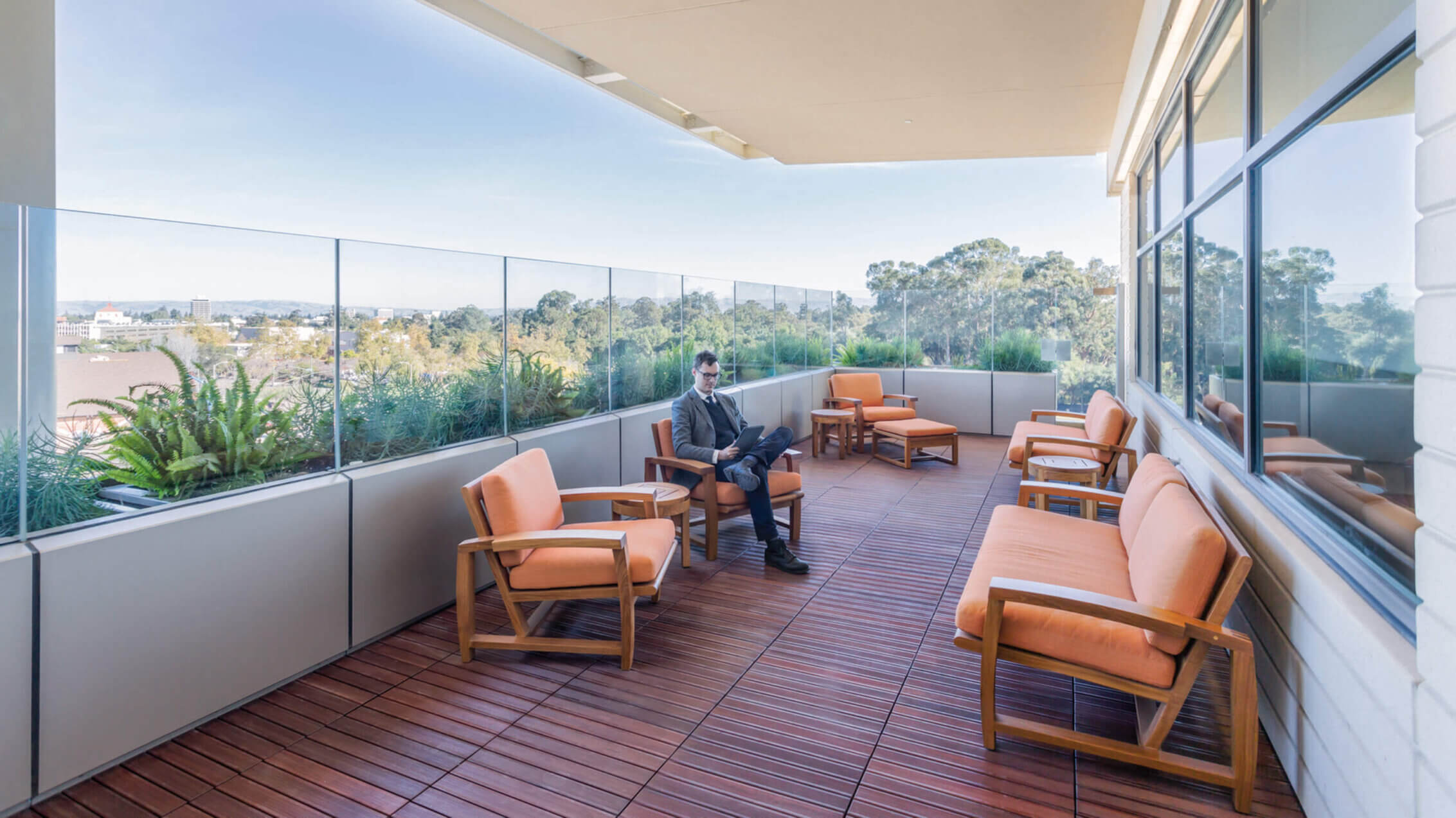 Photo of balcony adjacent to hospital staff lounge with trees and distant views