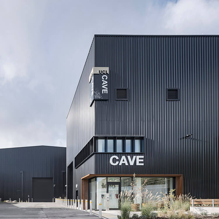 Black exterior of building with the words Cave on it.