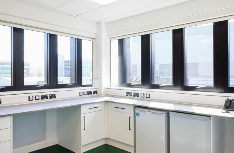 A white ancillary space with windows.