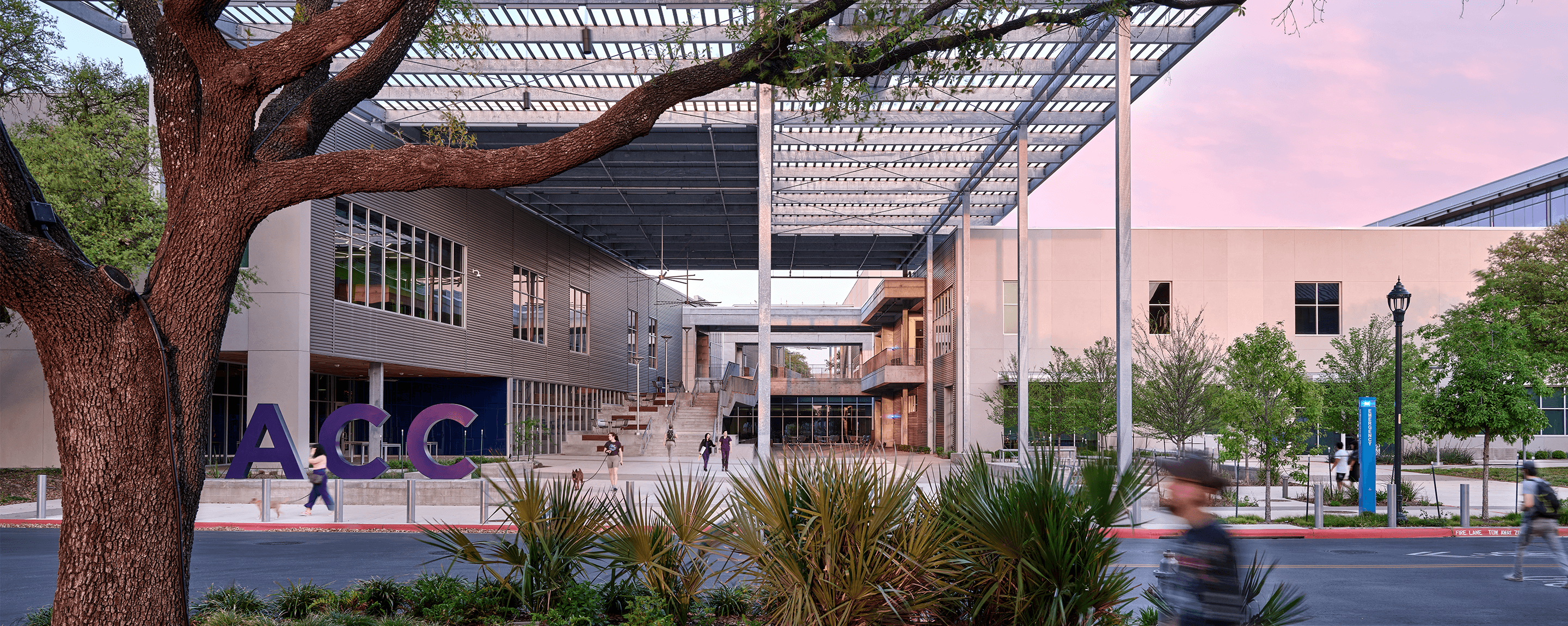 People walking in front of Austin Community College.