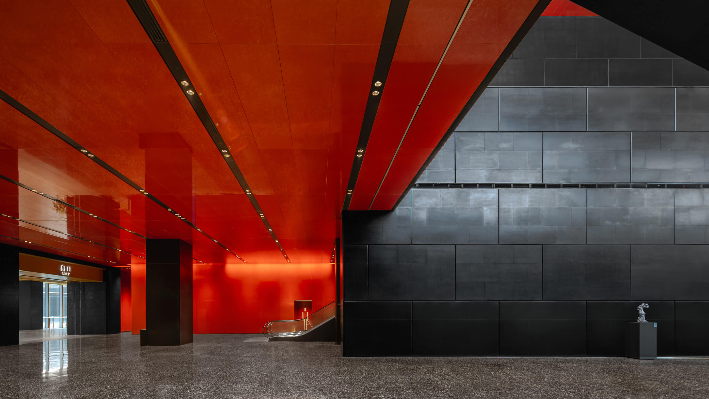 Red and black lobby with escalator