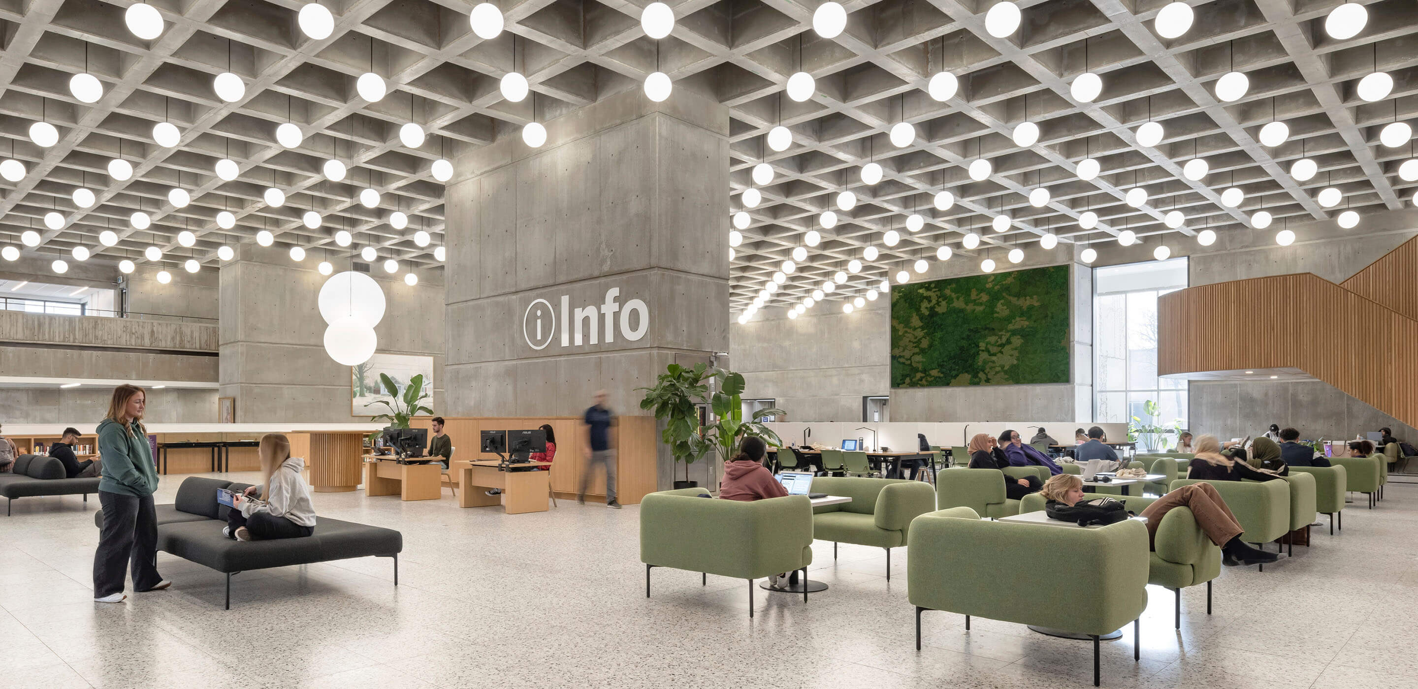 Library info desk surrounded by comfortable furniture