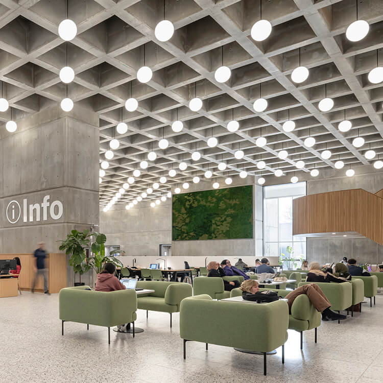 Library info desk surrounded by comfortable furniture