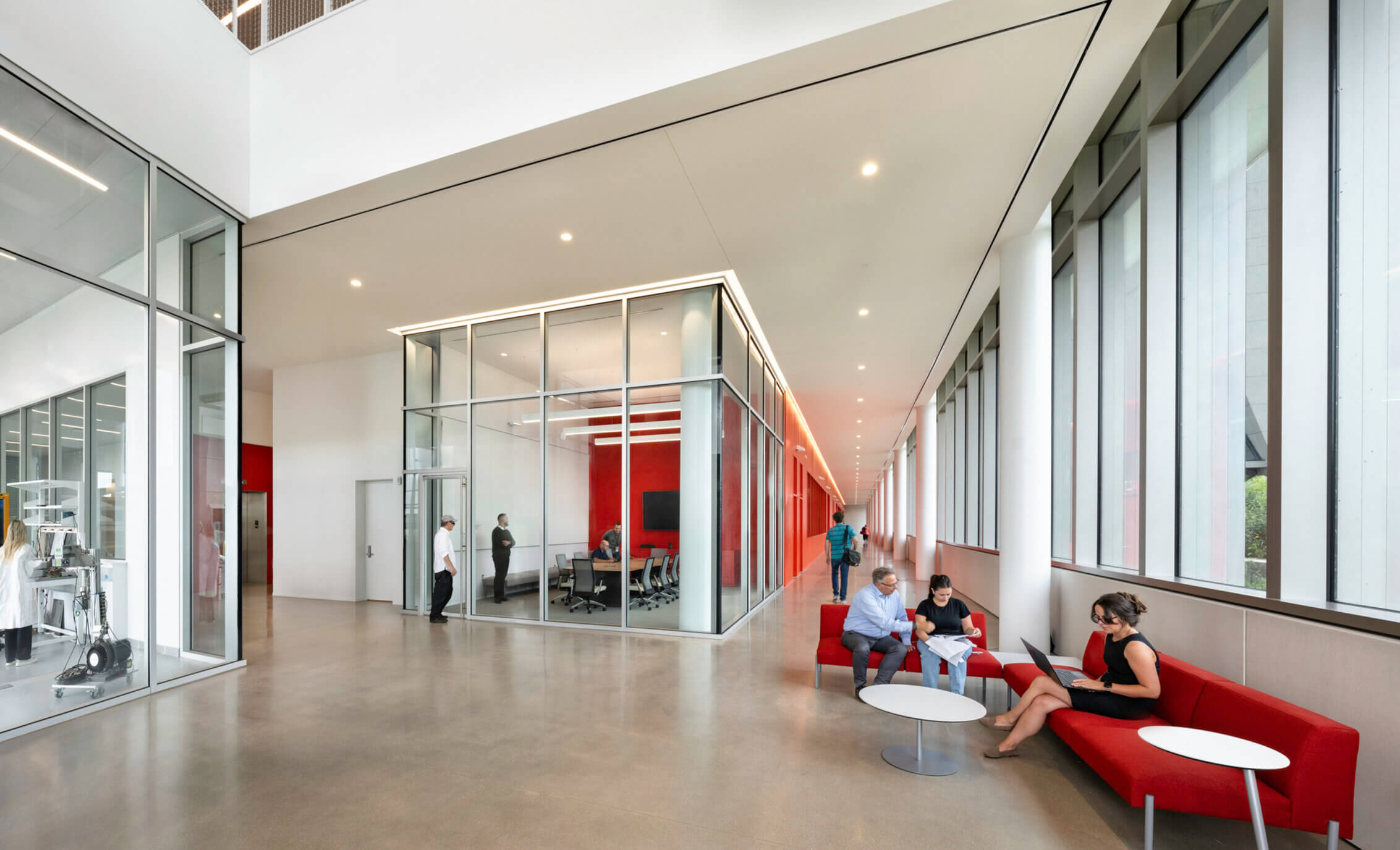 People seated in a building entrance area