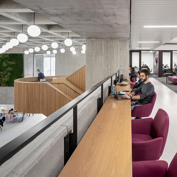 Second floor study area with a person working.