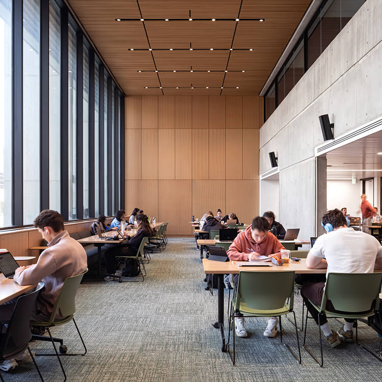 Open study area with wood ceiling and floor to ceiling windows