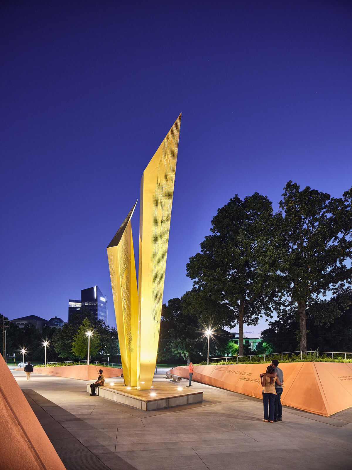 The illuminated beacon sculture at night.