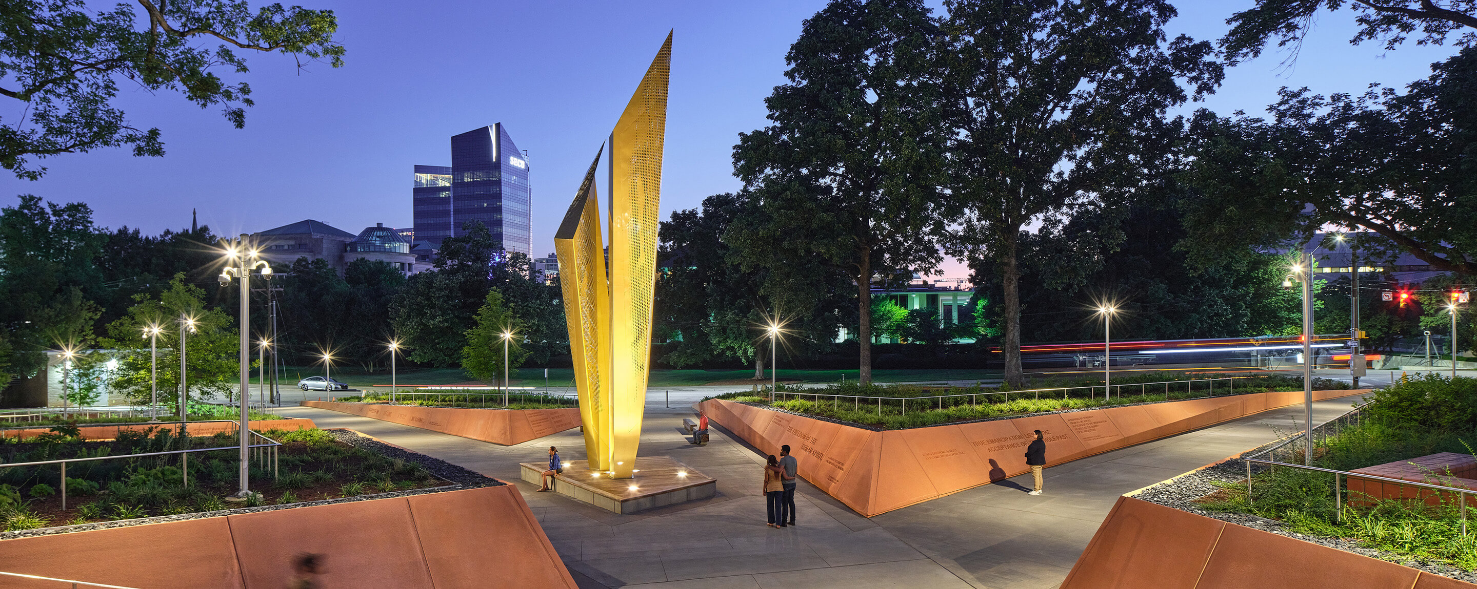 People in the park at dusk.