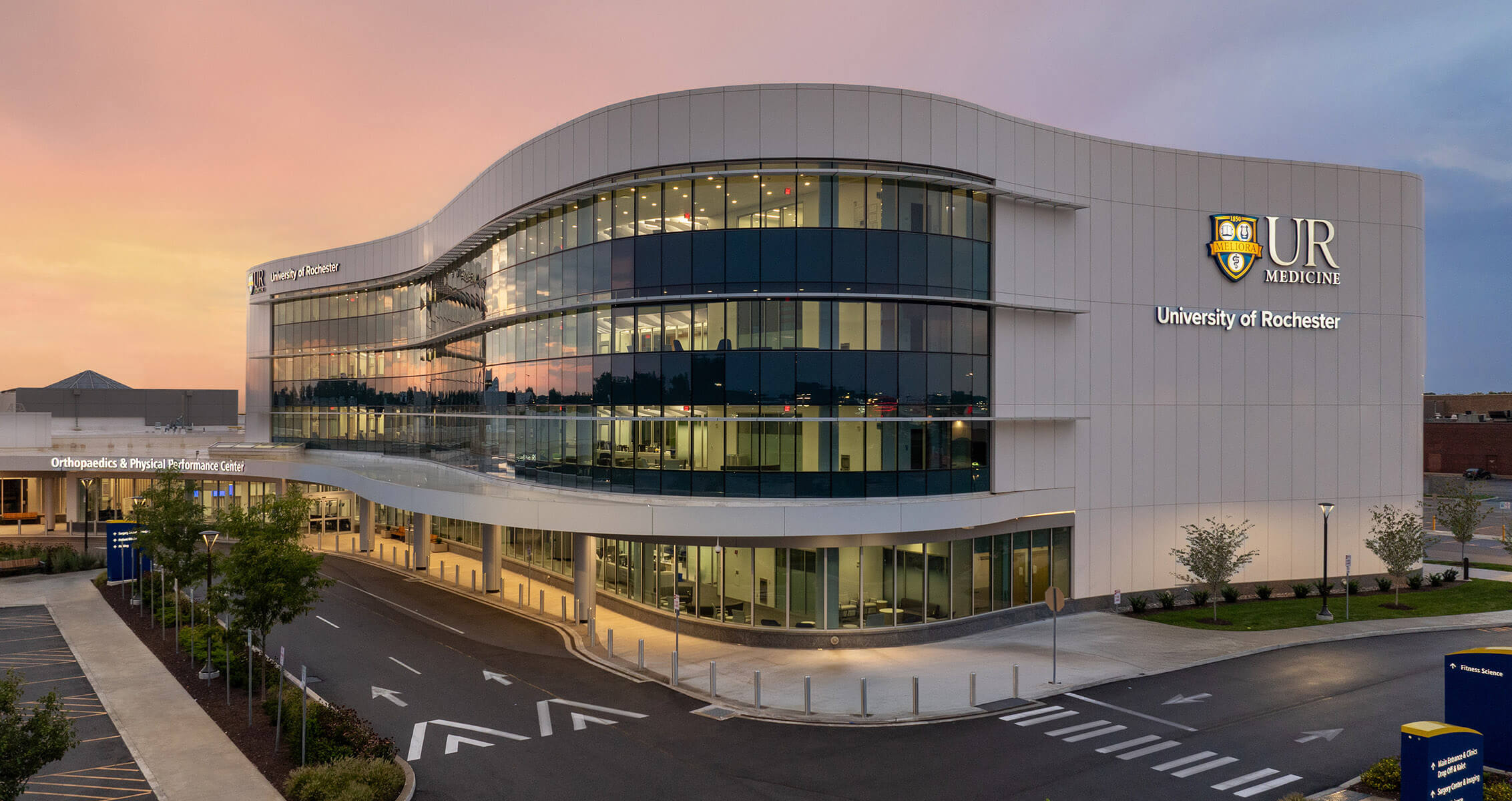 an exterior of a building at sunset