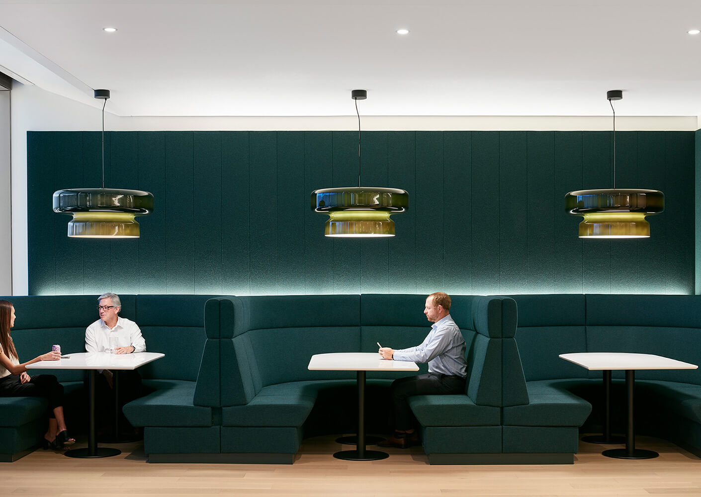 People sitting in green cafe