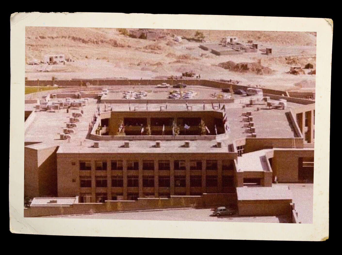 An aged aerial photograph of the school's exterior.