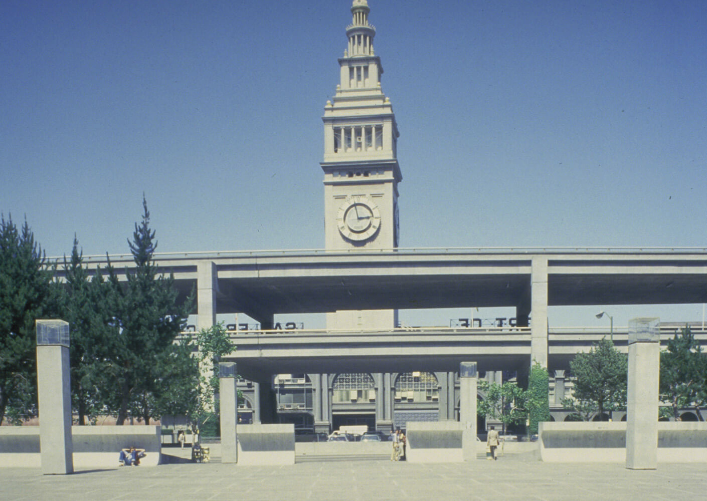 historic photo of the exterior facade blocked by a highway overpass