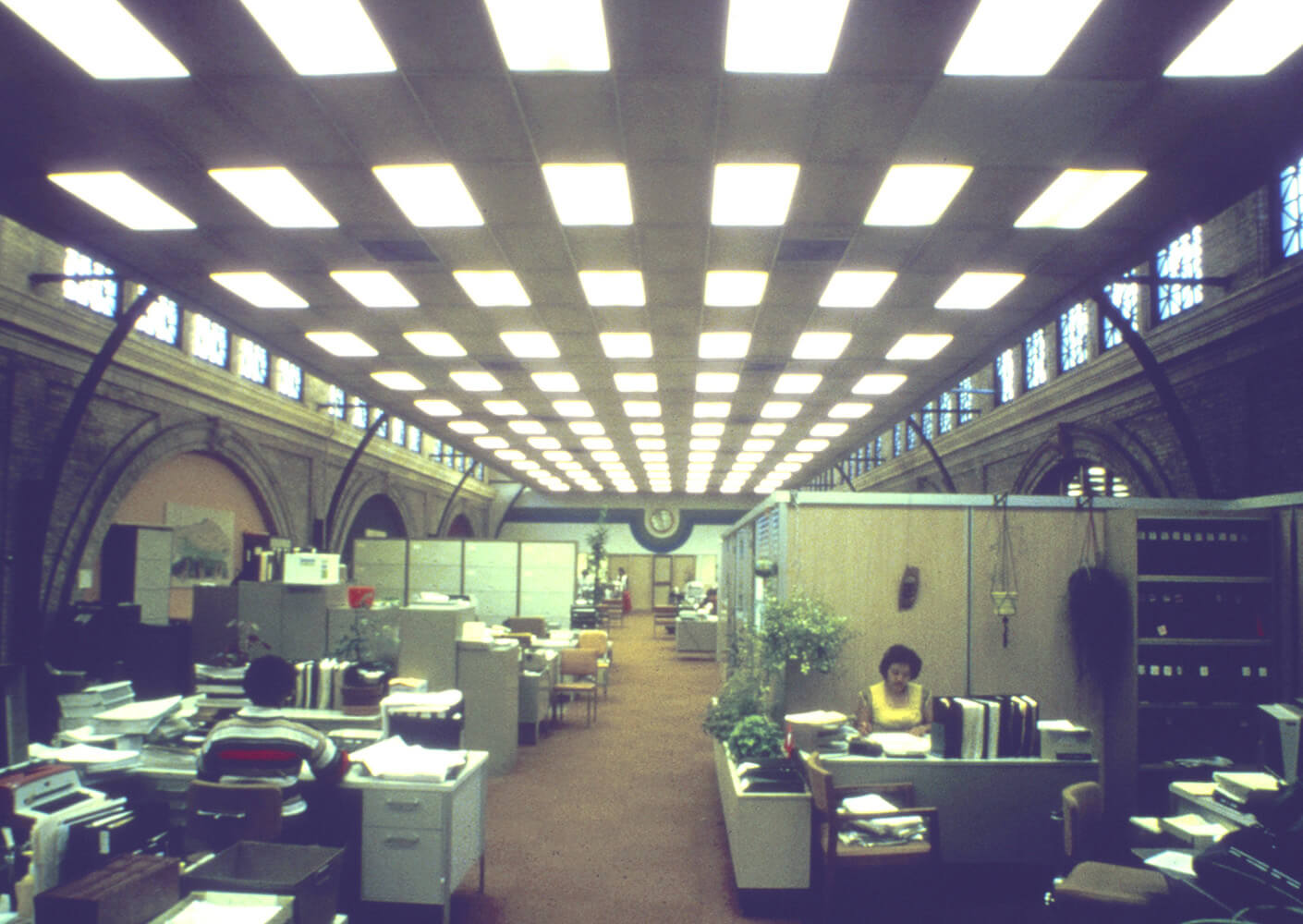 historic photo of mid-century cubicles in a confined space