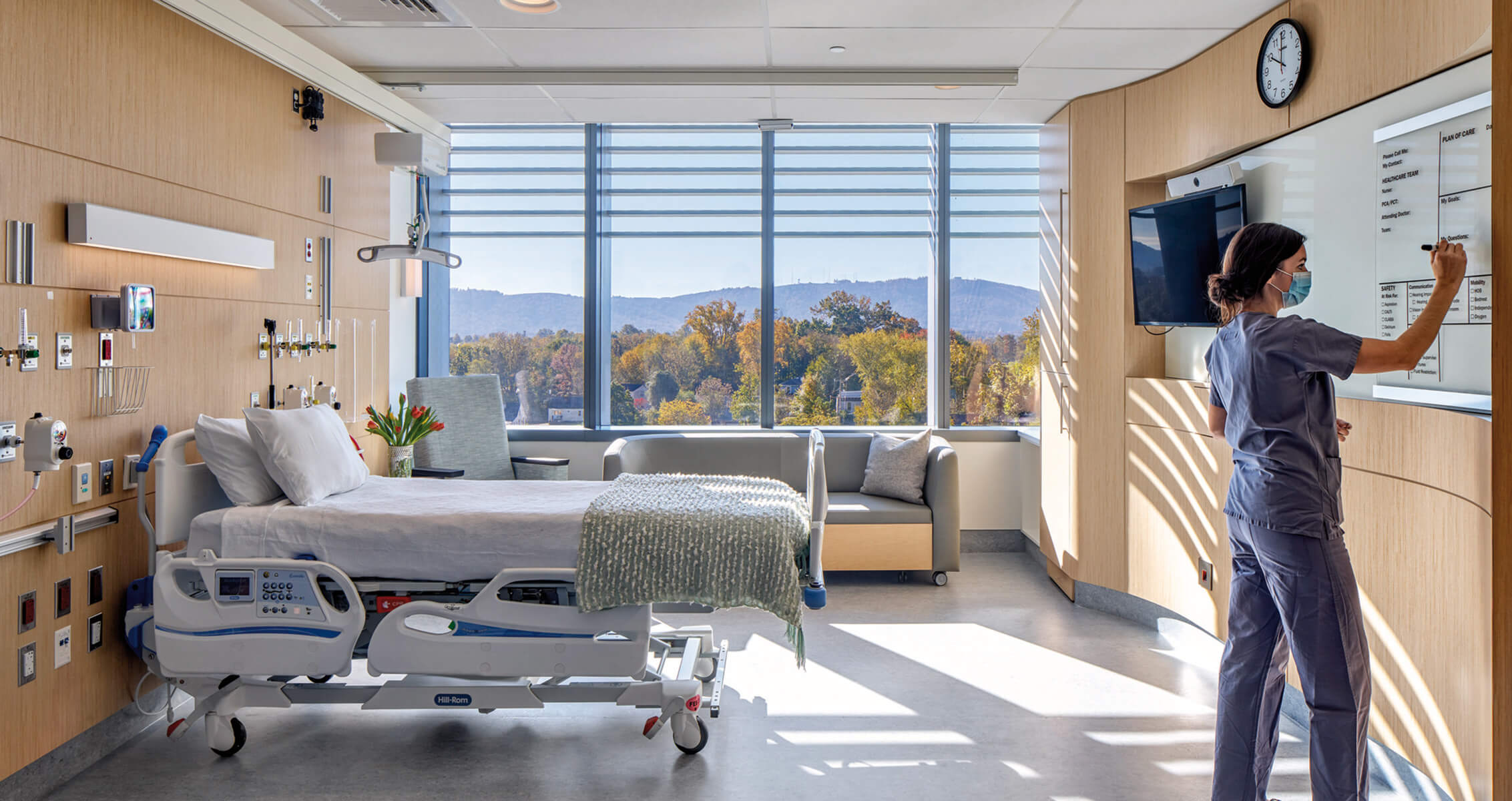 patient room in hospital with a nurse