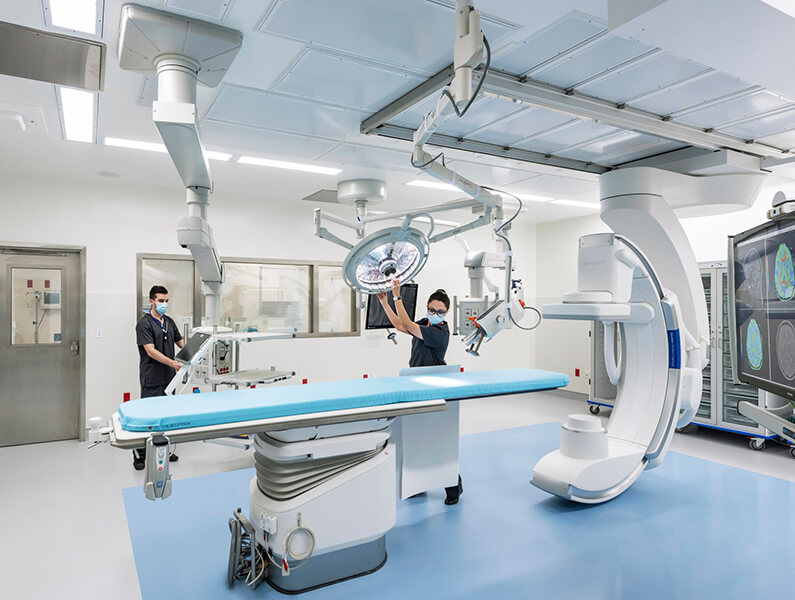 operating room with nurses setting up