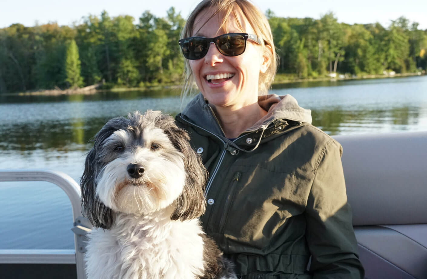 a person on a boat with a dog