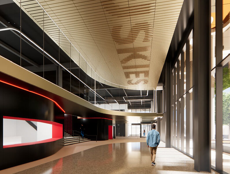 Double-height lobby with concession stand areas to the left and windows to the right