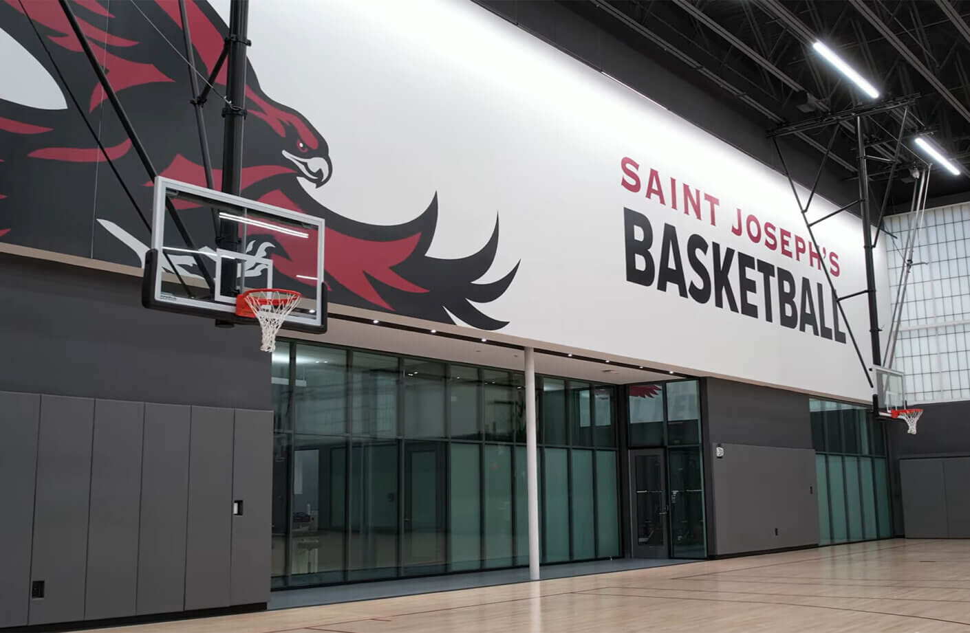 basketball court with bold branding and wood flooring