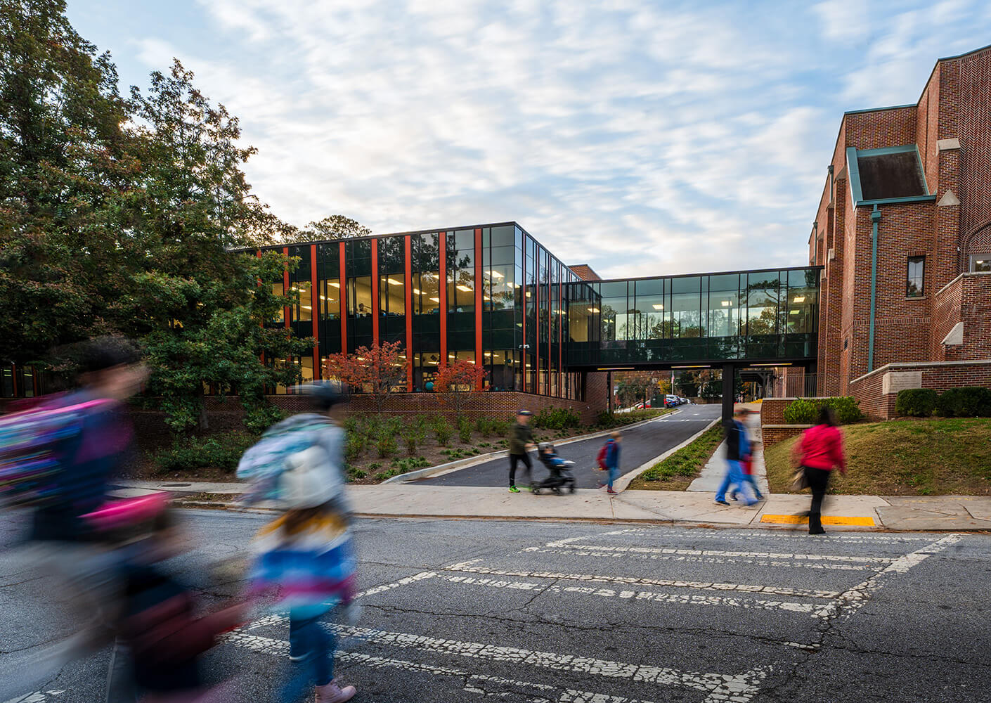 People walking in front of a school building