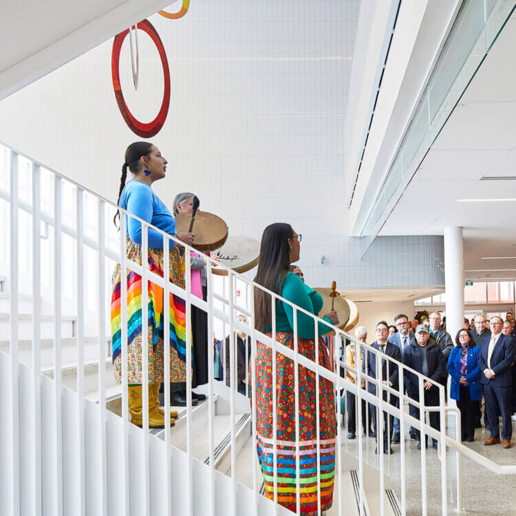Local performers on a stair in a community center