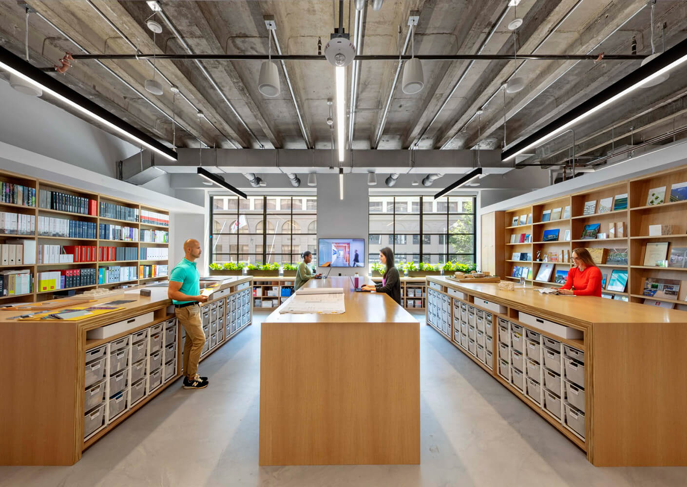 Materials library in office with people talking