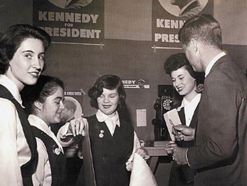 Black and white image of people meeting for presidential campaign