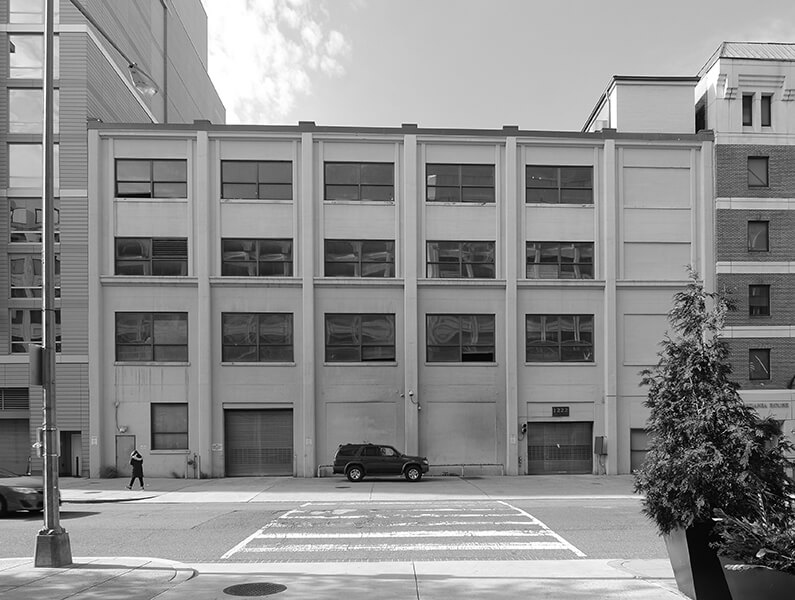 Black and white image of exterior industrial building
