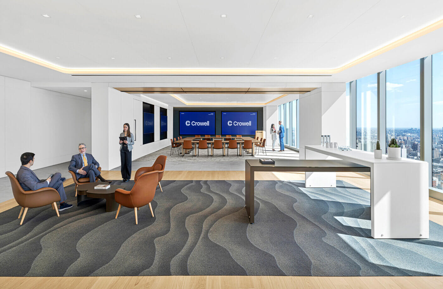 Conference room with views to city and employees meeting nearby