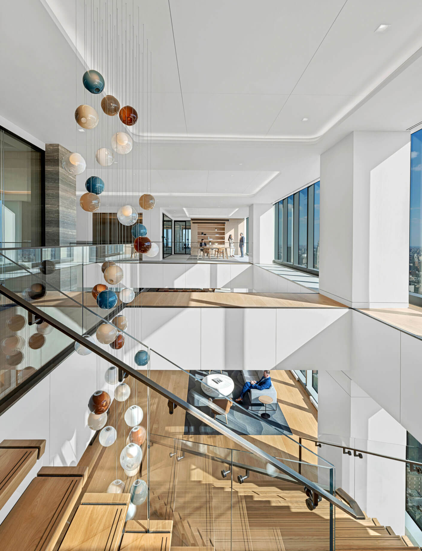 Interconnecting stair with statement hanging art piece in center