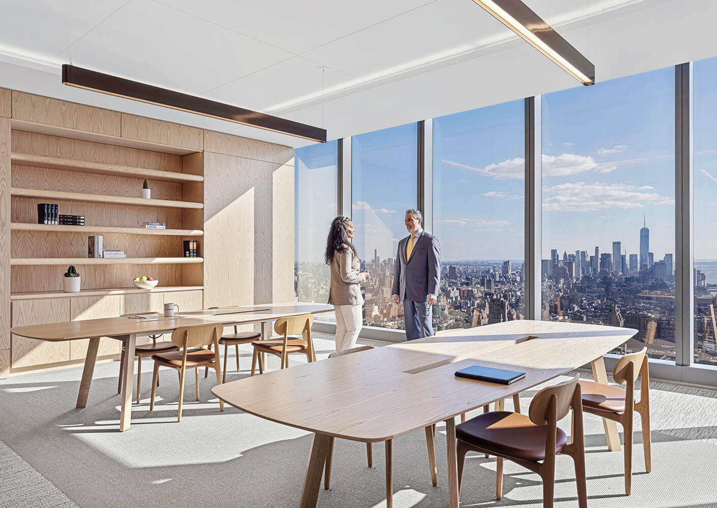 Conference room with employees standing
