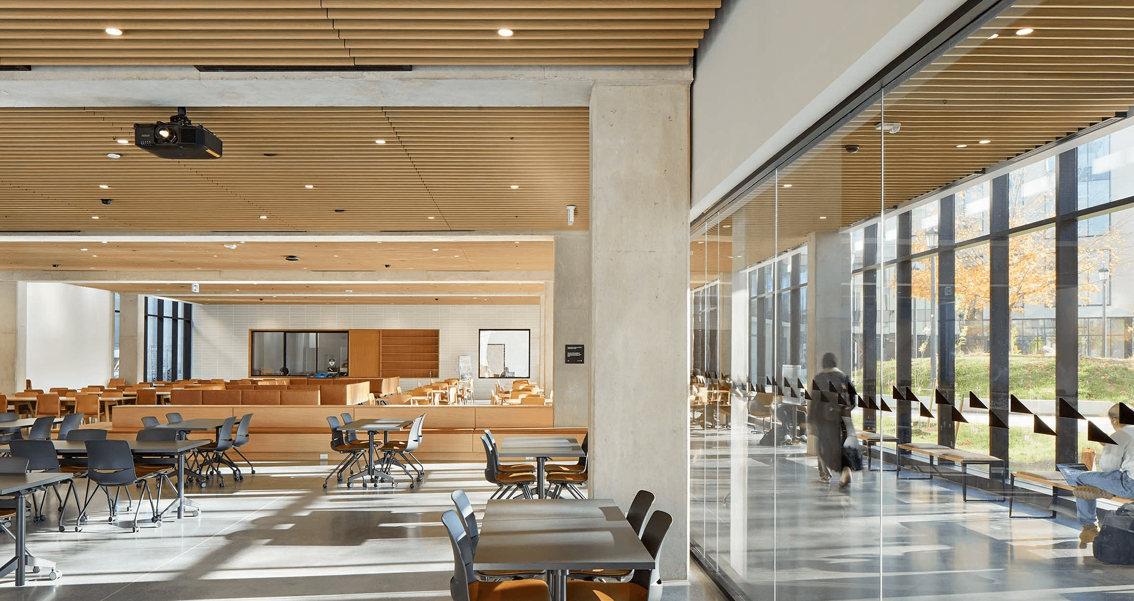 North incubator collaboration space with cafe with tables and chairs.
