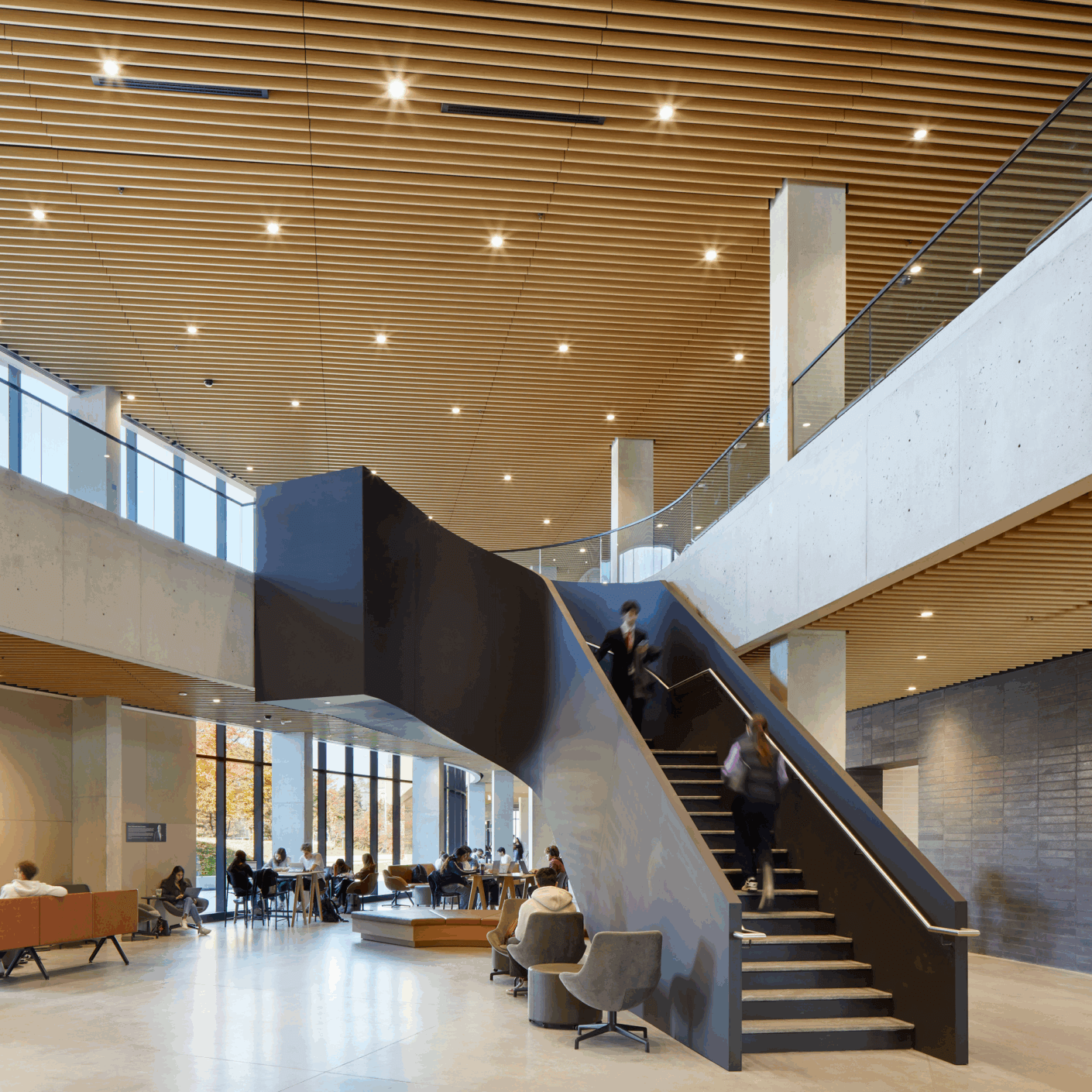 Staircase in entry lobby leading to second floor.