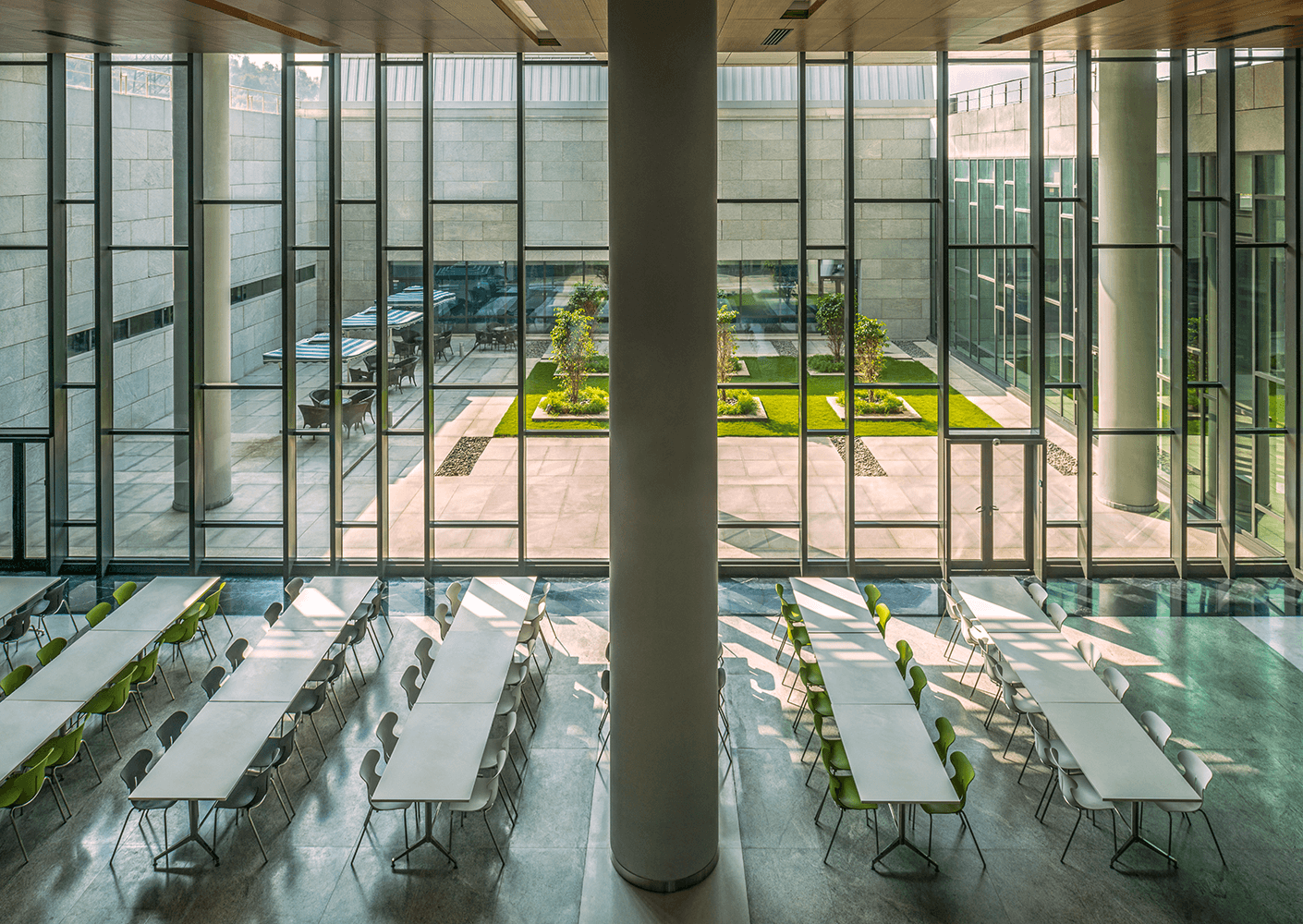Interior view looking outside with long tables