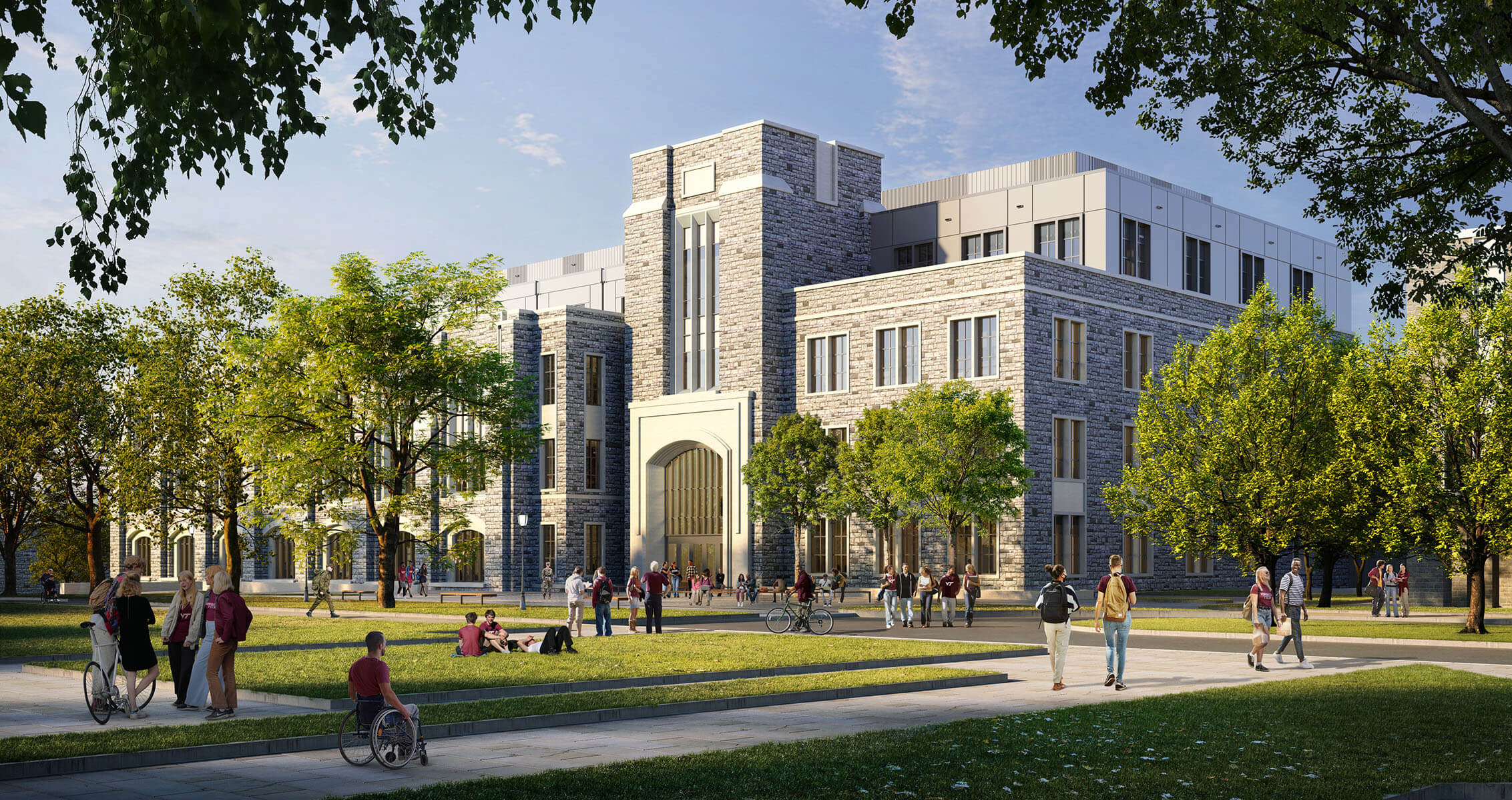 University building made of grey dolomite stone with students socializing on a sunny campus lawn, surrounded by trees.