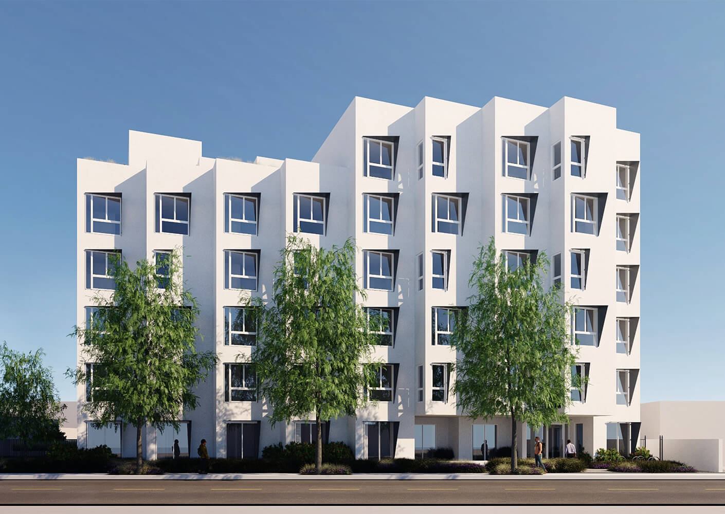 Modern multi-story white apartment building with geometric windows and green trees against a clear blue sky.