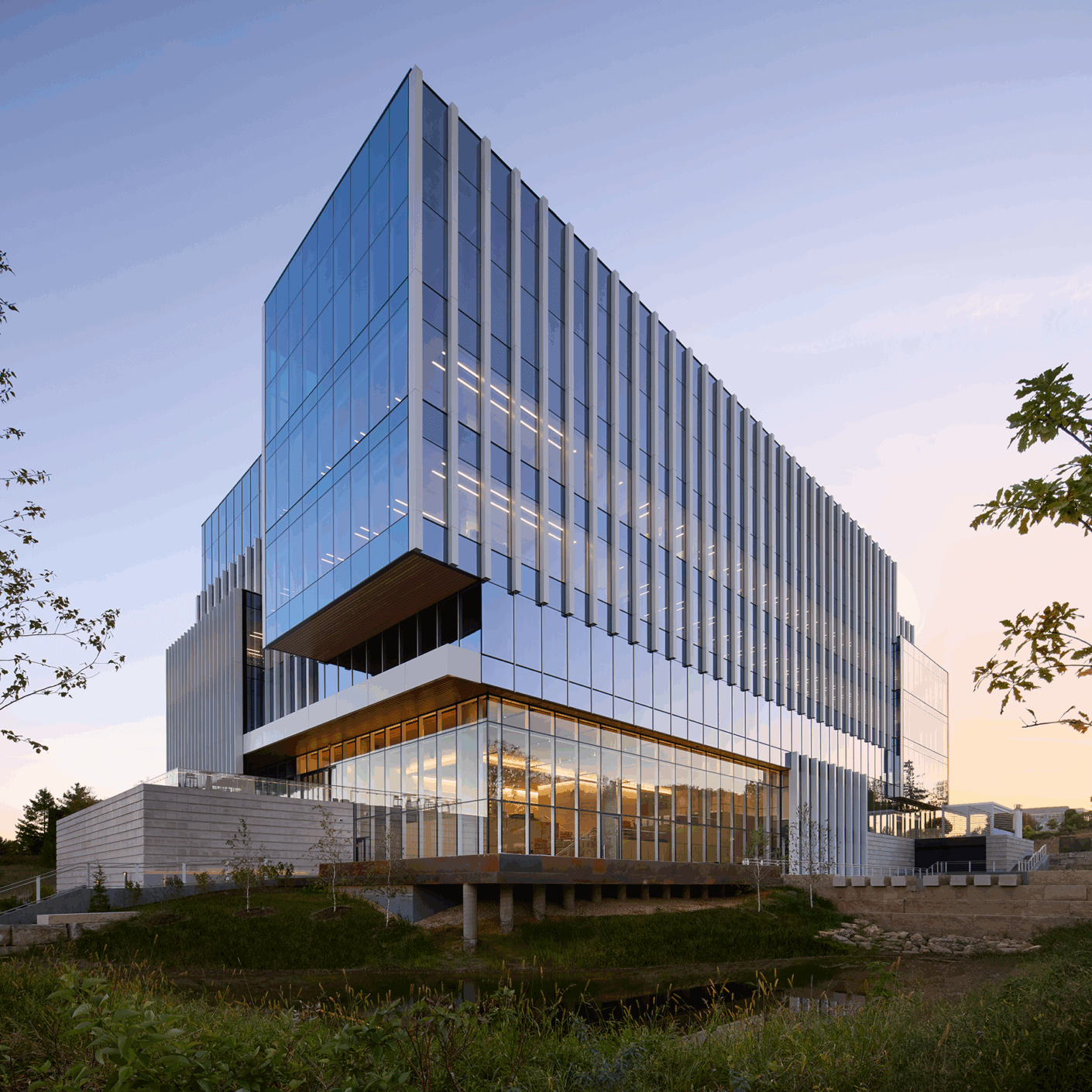 Modern glassbuilding illuminated at sunset
