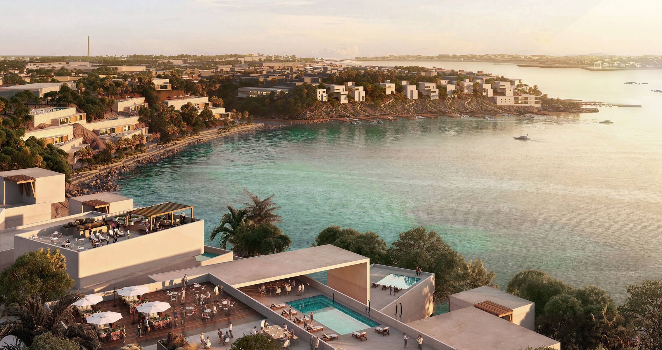 Coastal luxury resort with terraces, pools, and scenic ocean views at sunset.