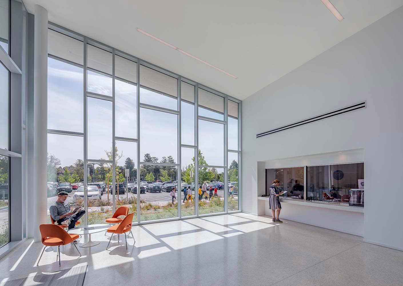 Modern waiting area with large windows and natural light.
