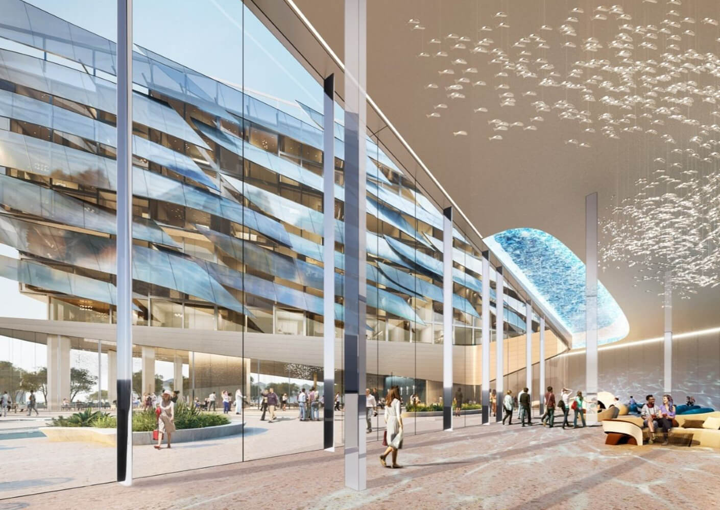 Modern atrium with glass facade and people walking, showcasing contemporary architecture.