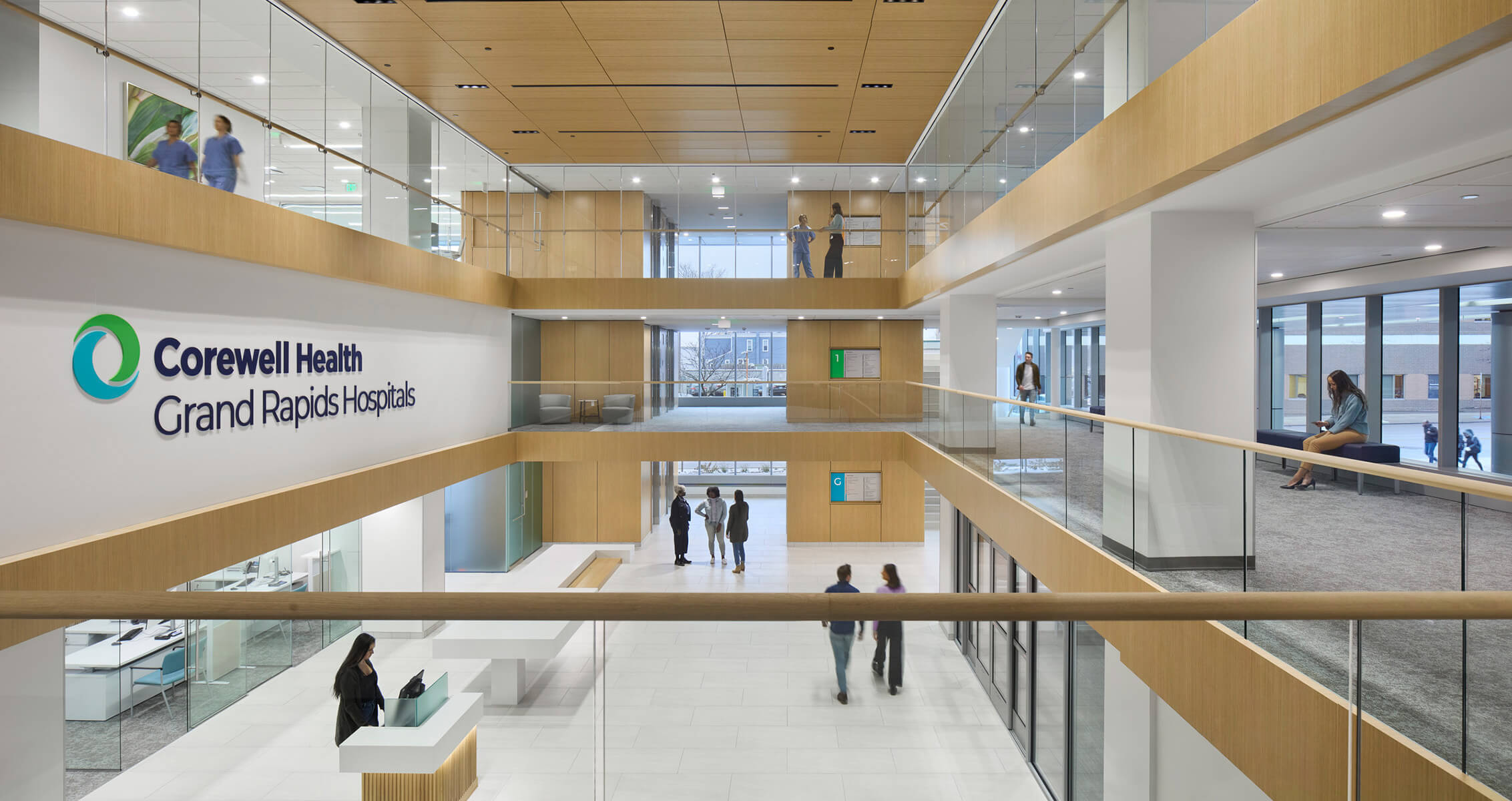 Multi-level hospital interior in wood and glass