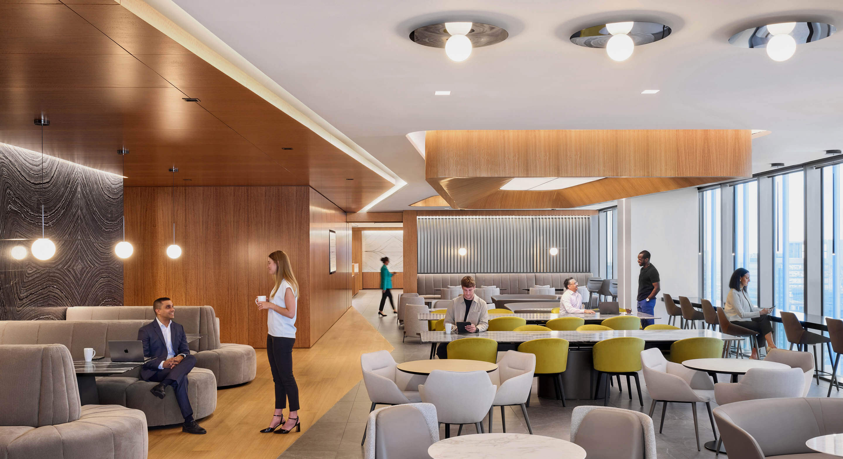 Modern office cafeteria with diverse professionals engaging and collaborating.